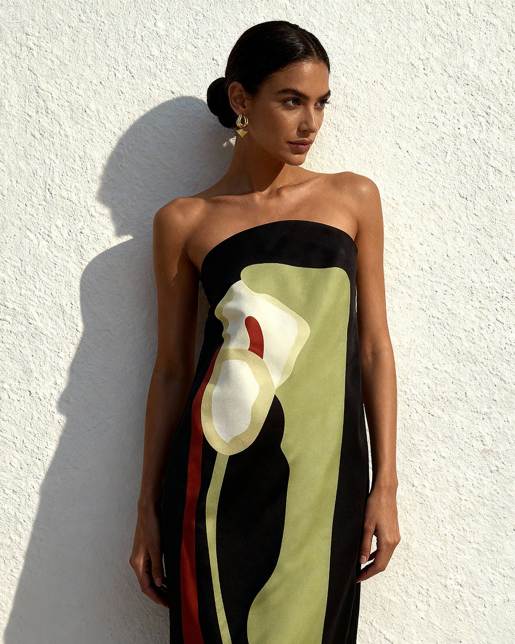 Black strapless bikini with artistic white floral and lime green color-block design