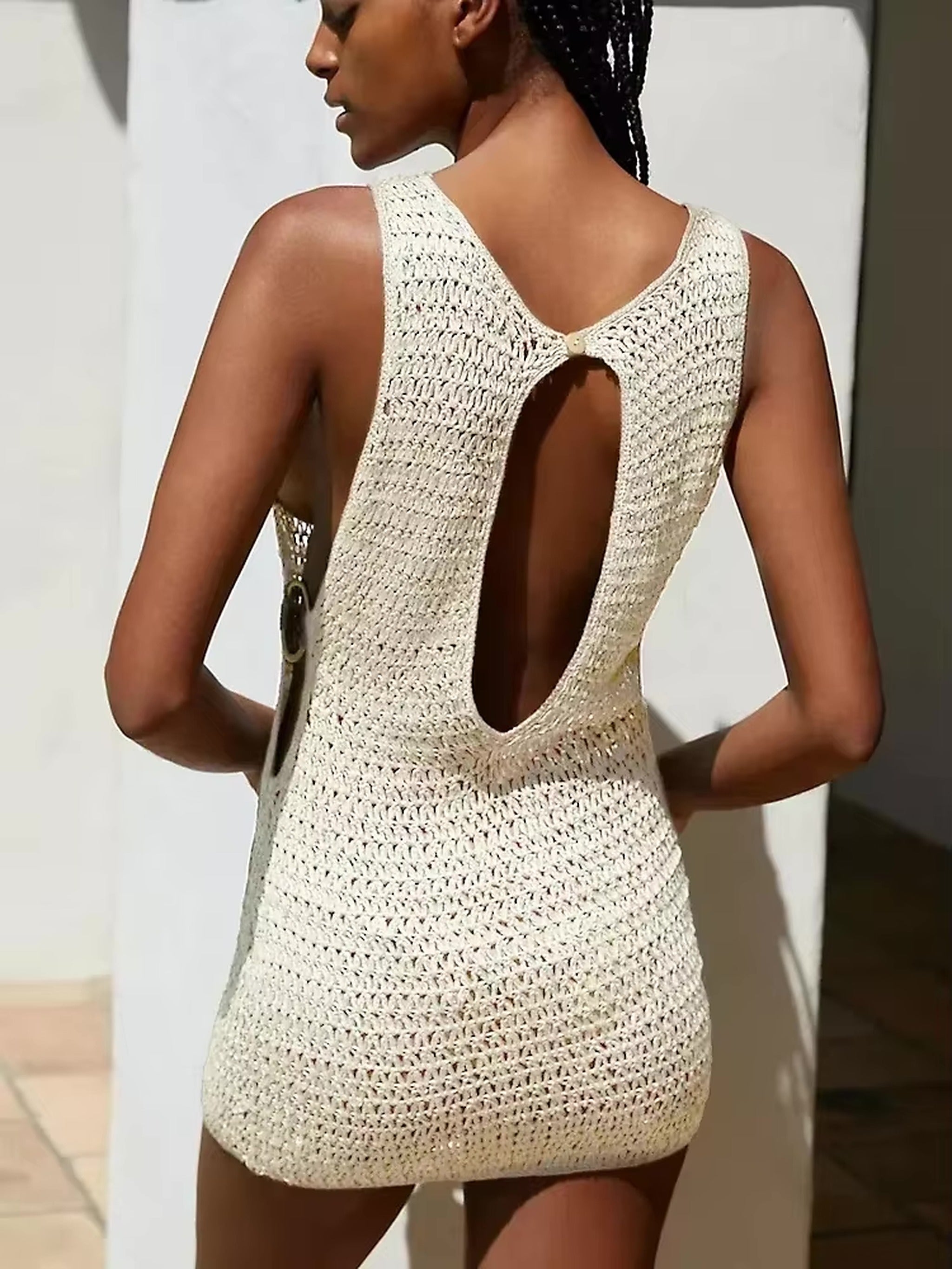 Cream knit bikini cover-up dress with open back cutout detail, shown from behind on model