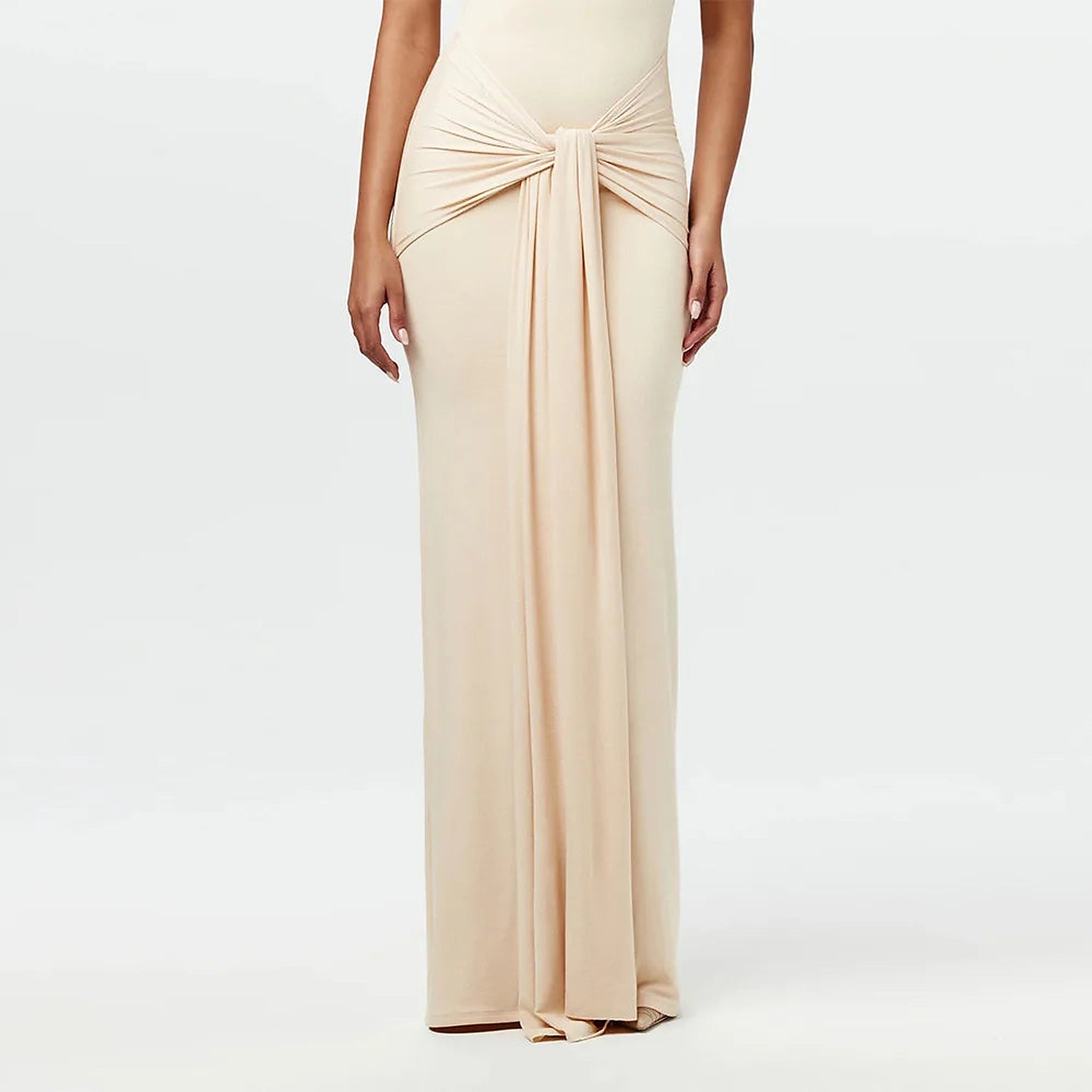 Cream tie-front one-piece swimsuit with gathered detail at waist and sleek maxi silhouette