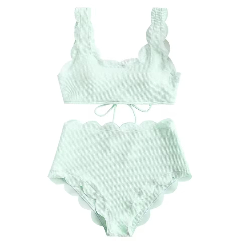 Mint green textured bikini with ruffled shoulder straps and scalloped edges on both top and bottom pieces